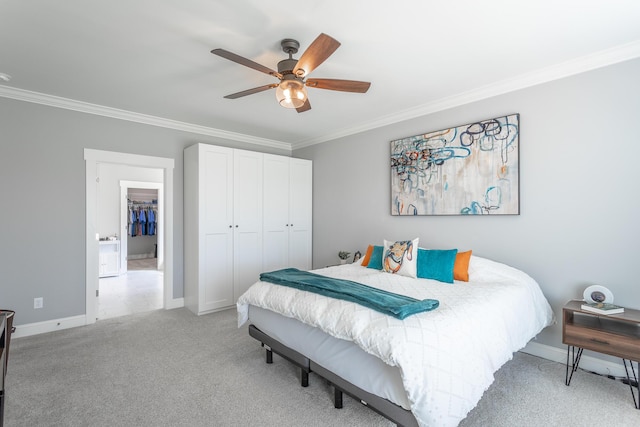 bedroom featuring light carpet, ornamental molding, a closet, baseboards, and ceiling fan