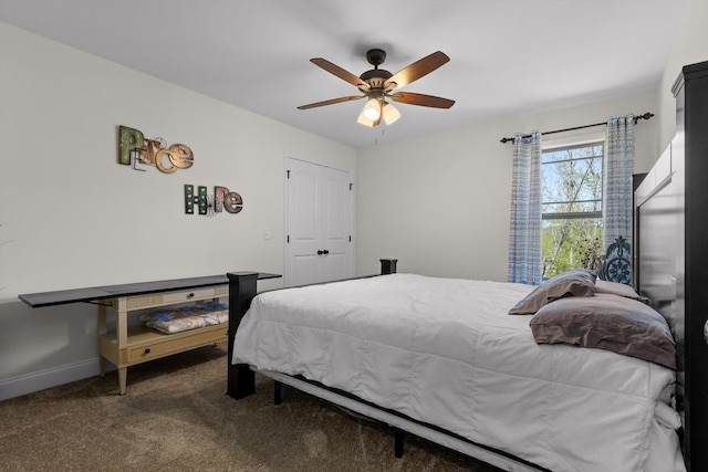 carpeted bedroom featuring ceiling fan and baseboards