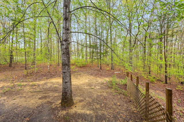 view of yard with a forest view
