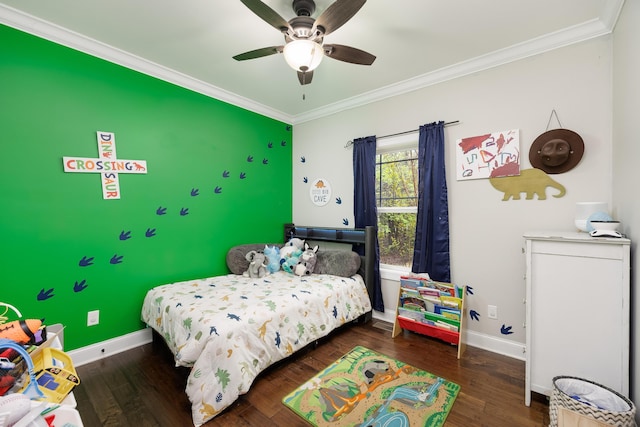 bedroom with baseboards, wood finished floors, ceiling fan, and crown molding