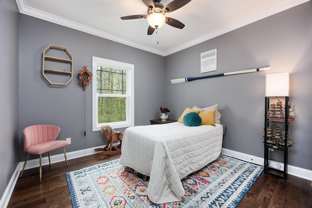 bedroom with crown molding, wood finished floors, and baseboards