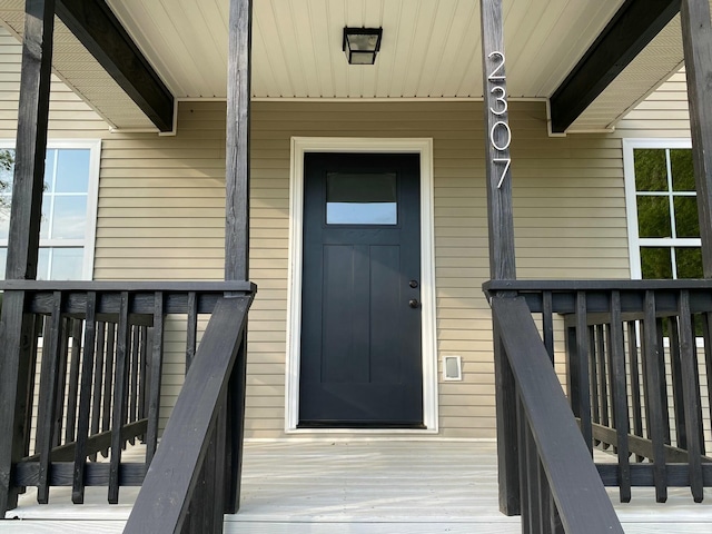 doorway to property featuring a porch