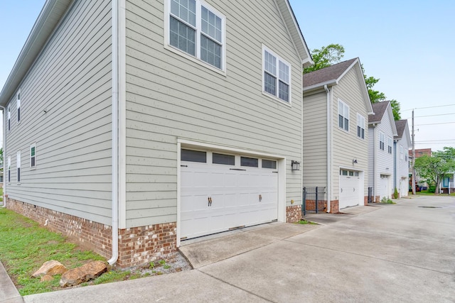 114 W 19th St, Chattanooga, TN 37408 - view of side of home featuring concrete driveway, a residential view, and a garage