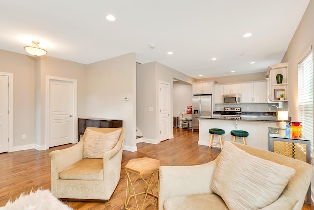 114 W 19th St, Chattanooga, TN 37408 - living area with light wood-style flooring, baseboards, and recessed lighting