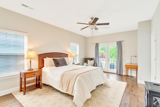 114 W 19th St, Chattanooga, TN 37408 - bedroom with light wood finished floors, visible vents, access to outside, and baseboards