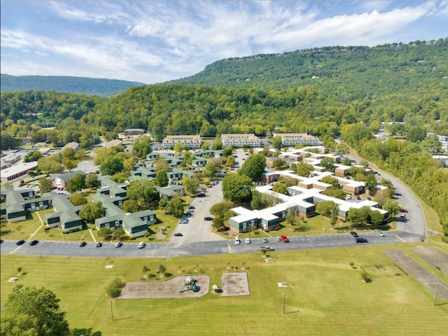 aerial view featuring a wooded view