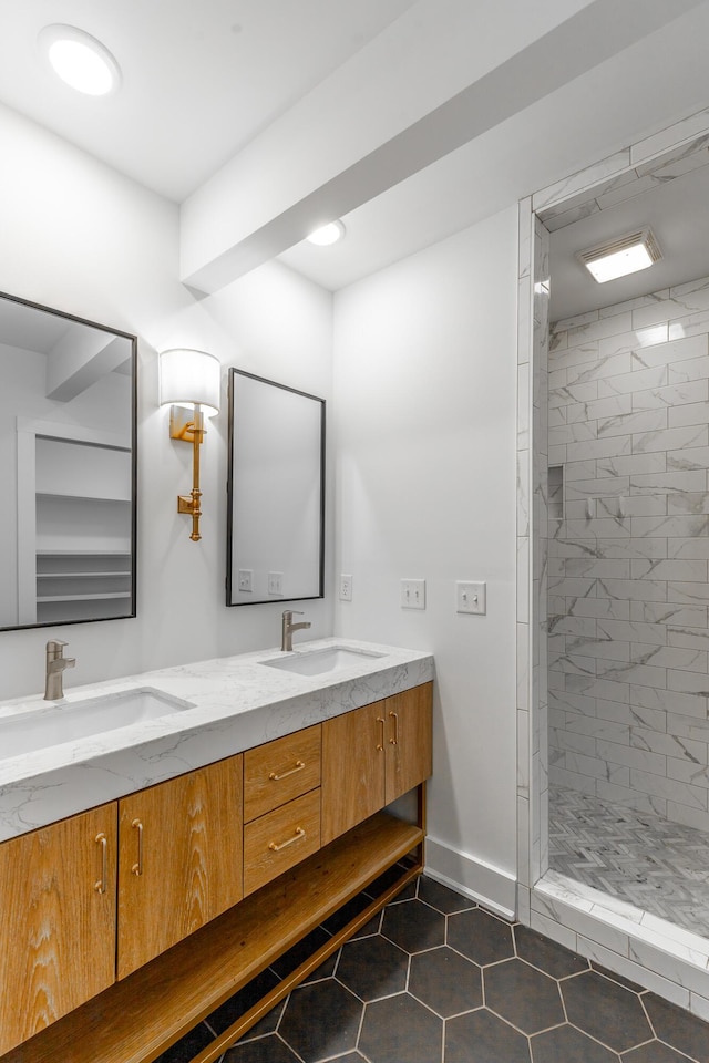 915 Barton Ave, Chattanooga, TN 37405 - bathroom with a tile shower, double vanity, a sink, and tile patterned flooring
