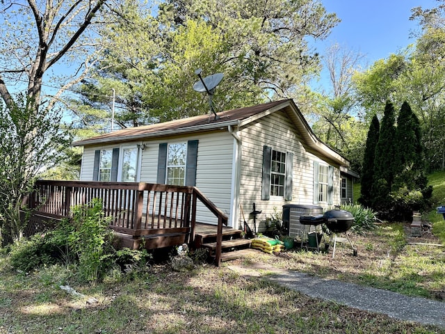 exterior space featuring a wooden deck