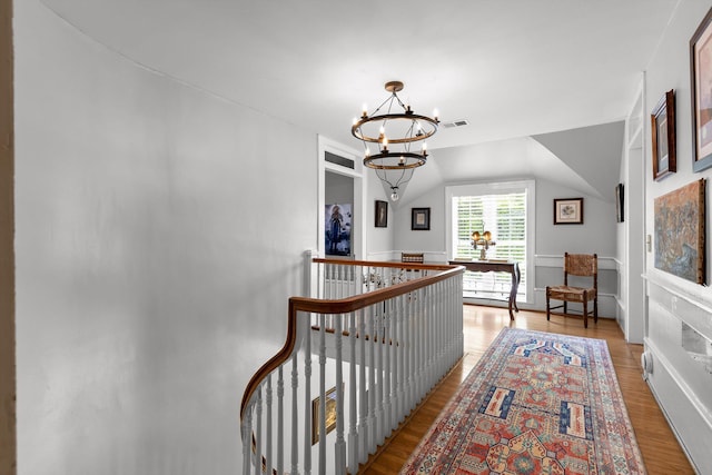 302 S Main St, Lafayette, GA 30728 - hall with an inviting chandelier, wood finished floors, an upstairs landing, and visible vents