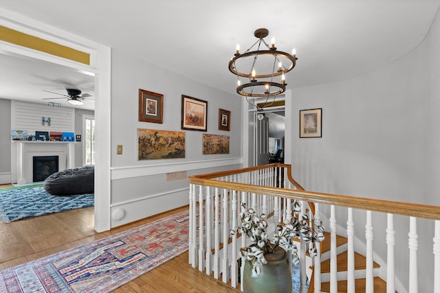 302 S Main St, Lafayette, GA 30728 - corridor featuring a chandelier, wood finished floors, and an upstairs landing