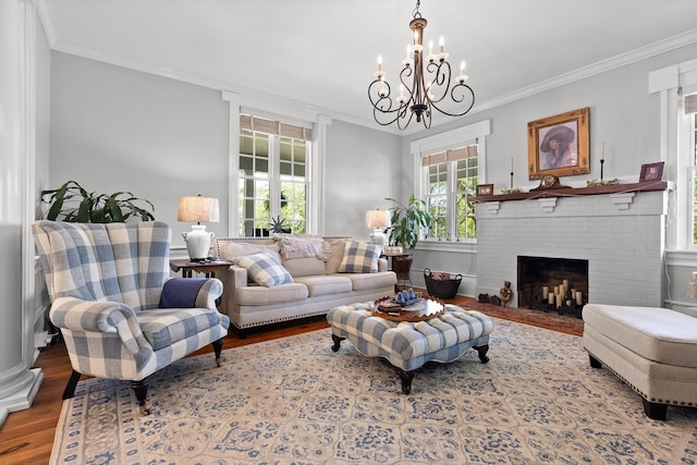 302 S Main St, Lafayette, GA 30728 - living room with an inviting chandelier, crown molding, wood finished floors, and a fireplace