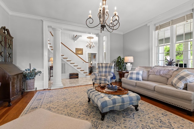 302 S Main St, Lafayette, GA 30728 - living area featuring wood finished floors, ornamental molding, decorative columns, a chandelier, and stairs