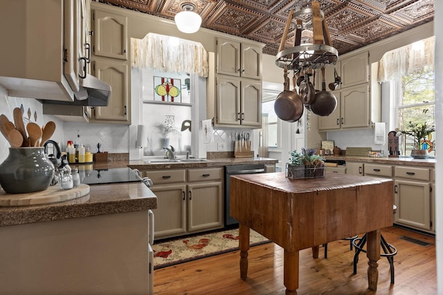 302 S Main St, Lafayette, GA 30728 - kitchen featuring dishwasher, an ornate ceiling, light wood-style flooring, and tasteful backsplash