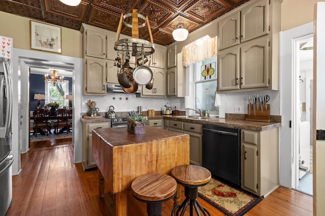 302 S Main St, Lafayette, GA 30728 - kitchen featuring a sink, an ornate ceiling, a chandelier, black dishwasher, and exhaust hood