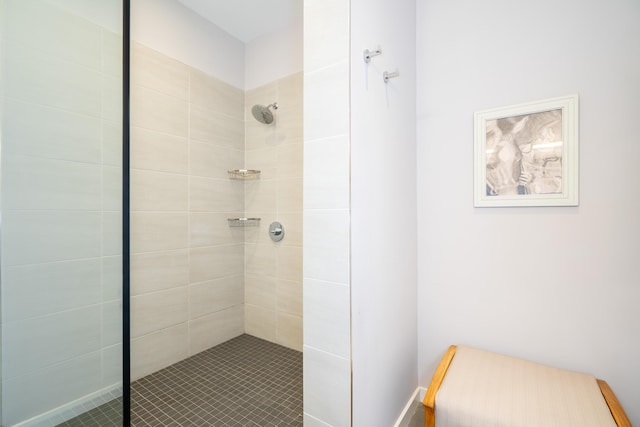 bathroom with tiled shower