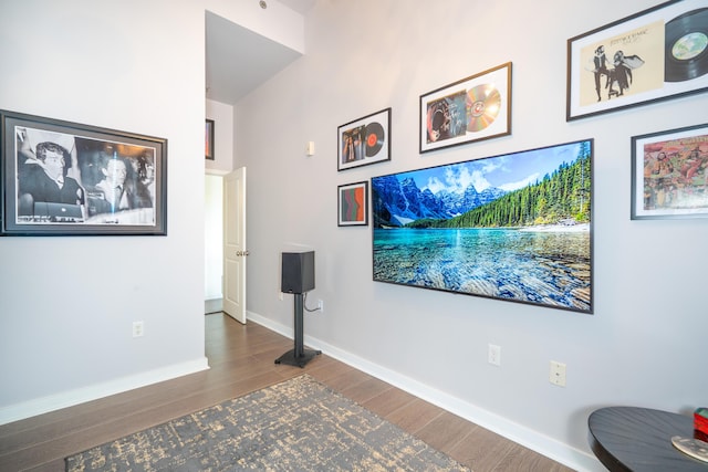 interior space with baseboards and wood finished floors