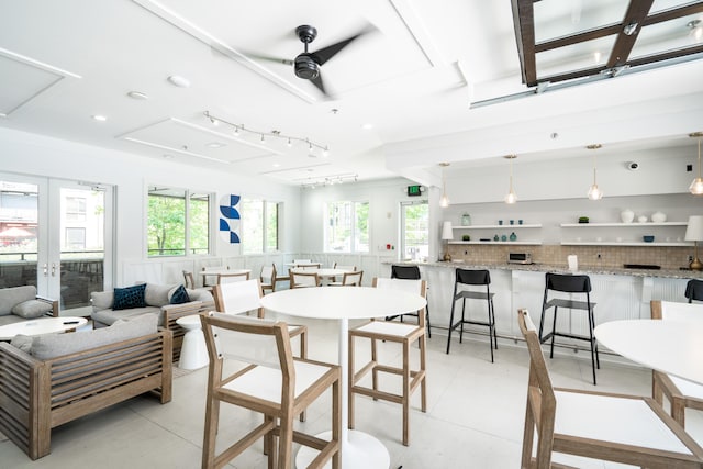 dining room featuring light tile patterned floors, ceiling fan, and french doors