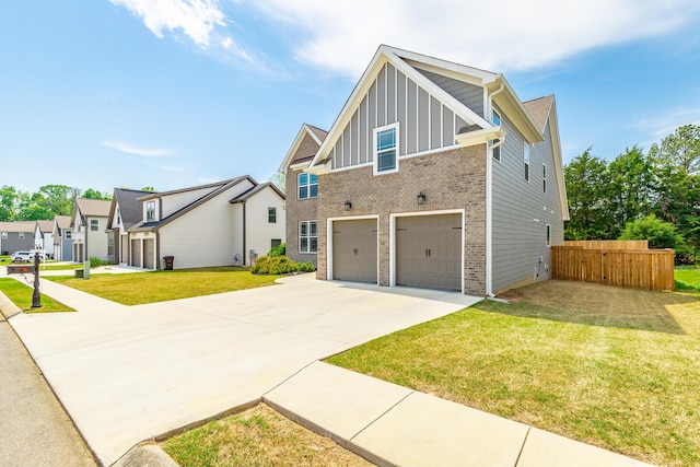 craftsman house with fence, concrete driveway, an attached garage, board and batten siding, and brick siding
