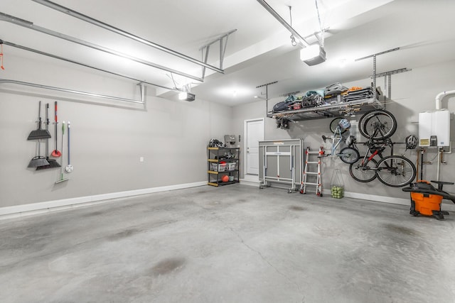 garage with baseboards and a garage door opener