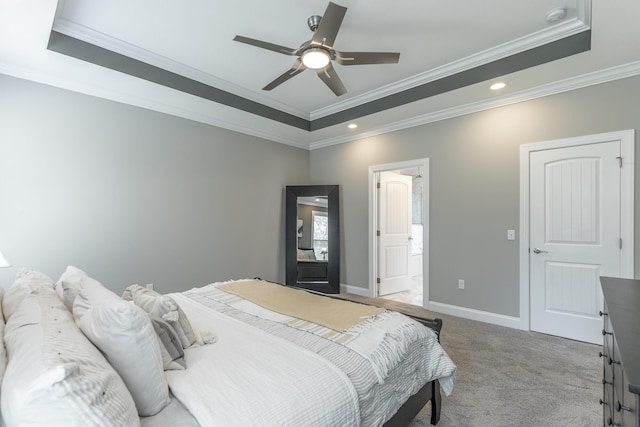 bedroom featuring a tray ceiling and crown molding