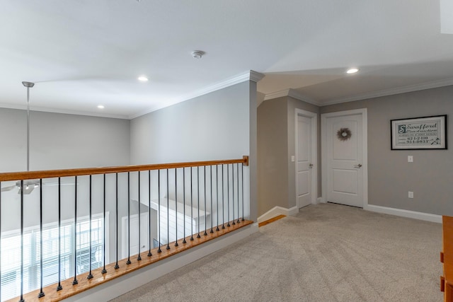 hall with carpet flooring, baseboards, recessed lighting, and ornamental molding