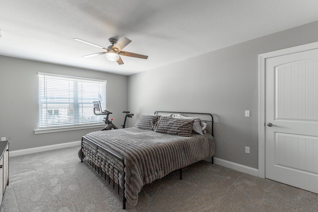 bedroom featuring ceiling fan, baseboards, and light colored carpet