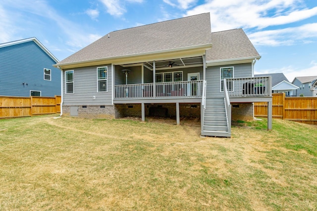 back of property with crawl space, a fenced backyard, a yard, and a wooden deck