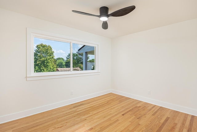 unfurnished room with light wood-style flooring, baseboards, and ceiling fan