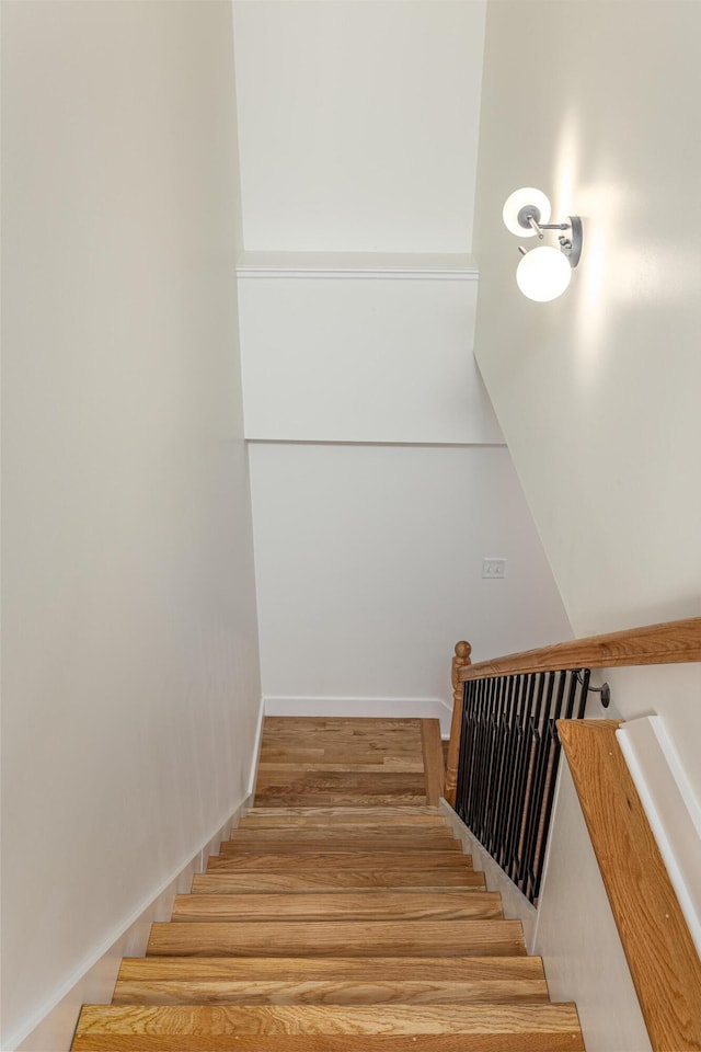 staircase featuring wood finished floors