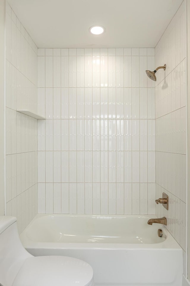 bathroom with toilet and shower / washtub combination