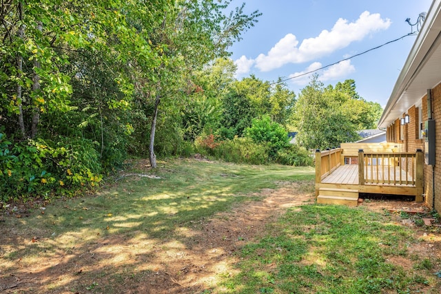 view of yard featuring a wooden deck