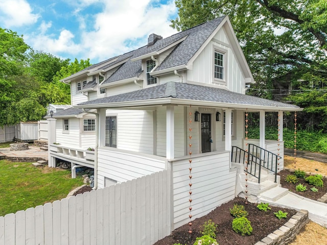 1306 Normal Ave, Chattanooga, TN 37405 - view of front of home featuring a chimney, fence, a porch, and a shingled roof