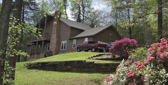 view of grassy yard with an attached garage