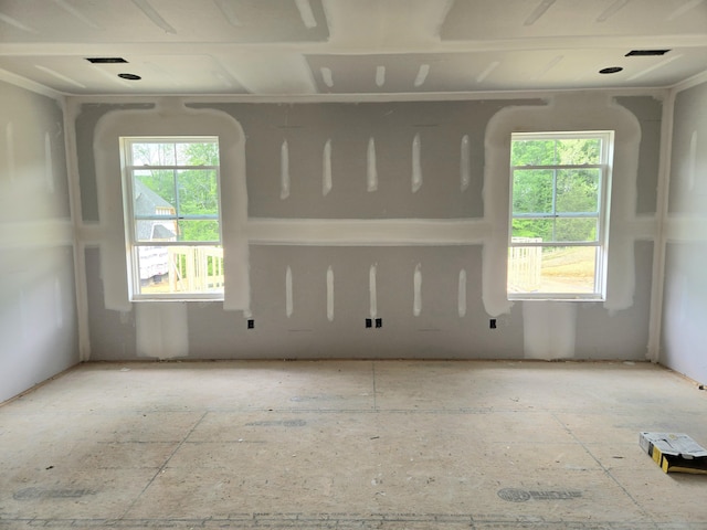 unfurnished room featuring a wealth of natural light