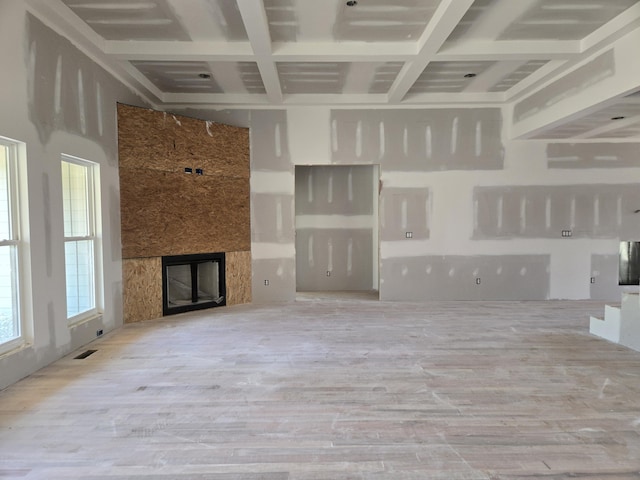 10597 Brownspring Dr Unit 115, Apison, TN 37302 - unfurnished living room with beam ceiling, a large fireplace, wood finished floors, and coffered ceiling