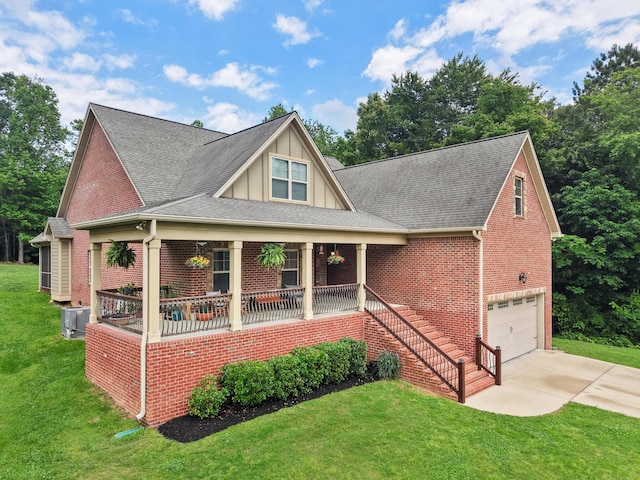 7415 Island Manor Dr, Harrison, TN 37341 - view of front of home featuring covered porch, driveway, brick siding, a garage, and a front lawn