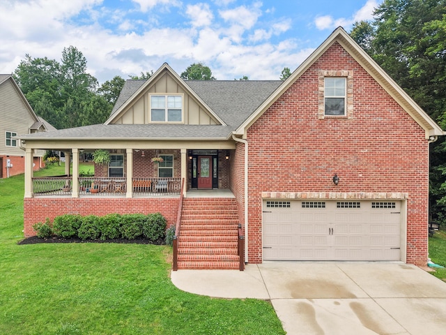 7415 Island Manor Dr, Harrison, TN 37341 - view of front of house with board and batten siding, brick siding, an attached garage, and a porch