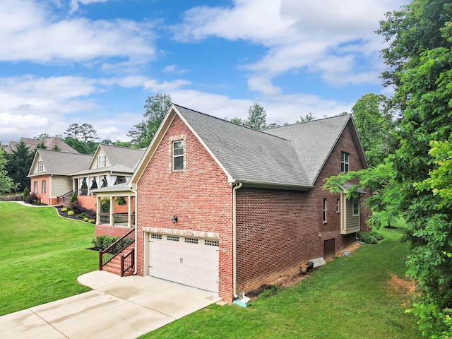 7415 Island Manor Dr, Harrison, TN 37341 - view of side of property featuring brick siding, concrete driveway, a garage, and a yard