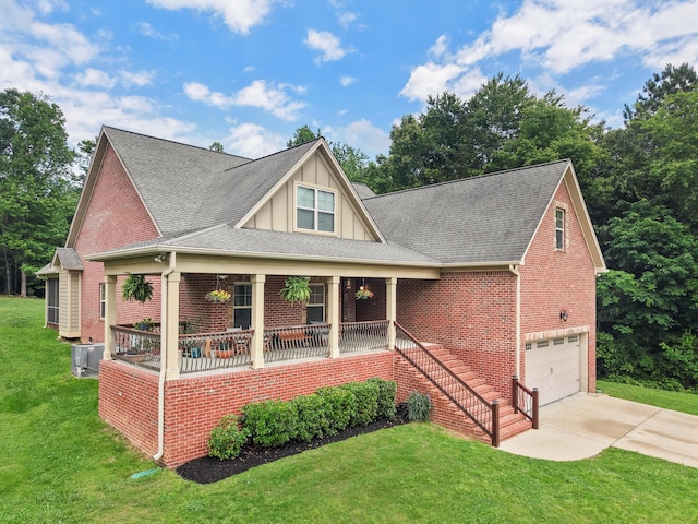 7415 Island Manor Dr, Harrison, TN 37341 - view of front of property featuring brick siding, concrete driveway, covered porch, and a garage