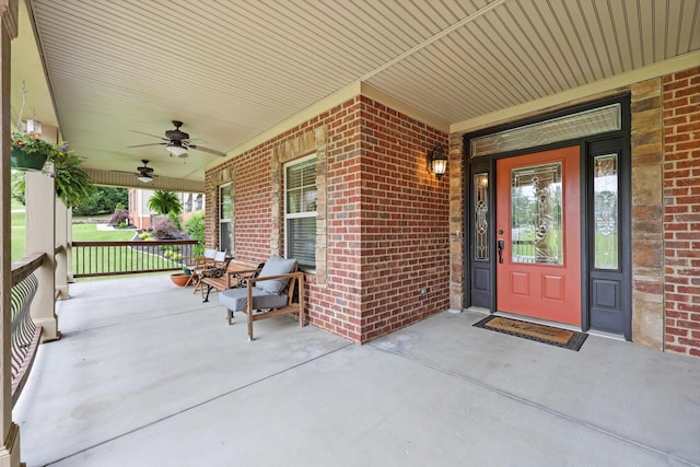 7415 Island Manor Dr, Harrison, TN 37341 - view of exterior entry with covered porch, brick siding, and ceiling fan