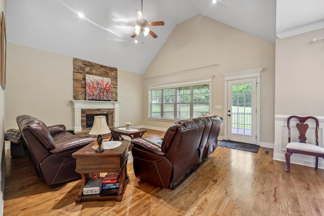 7415 Island Manor Dr, Harrison, TN 37341 - living room featuring a ceiling fan, high vaulted ceiling, a fireplace, light wood-style floors, and plenty of natural light