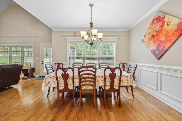 7415 Island Manor Dr, Harrison, TN 37341 - dining area featuring a chandelier, healthy amount of natural light, light wood-style flooring, wainscoting, and crown molding