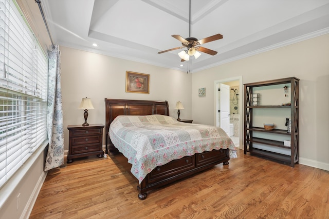7415 Island Manor Dr, Harrison, TN 37341 - bedroom with light wood-style floors, baseboards, crown molding, recessed lighting, and a raised ceiling