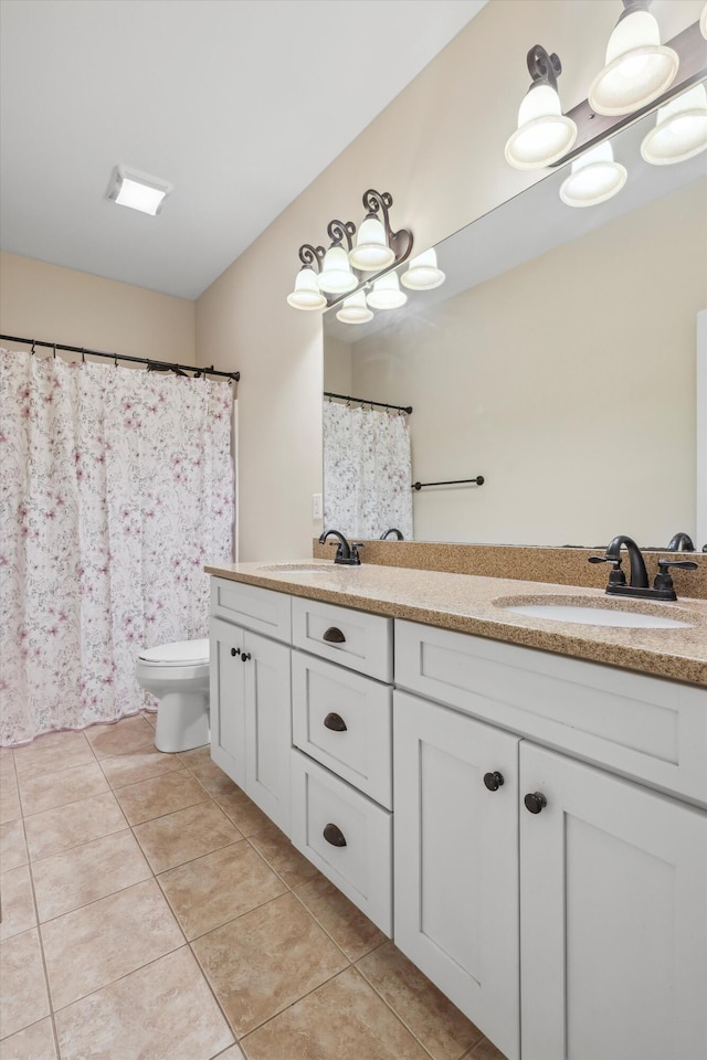 7415 Island Manor Dr, Harrison, TN 37341 - bathroom featuring tile patterned floors, double vanity, and toilet