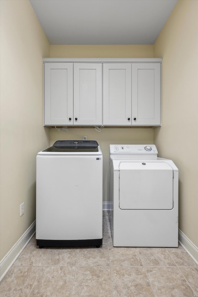 7415 Island Manor Dr, Harrison, TN 37341 - washroom with independent washer and dryer, cabinet space, and baseboards