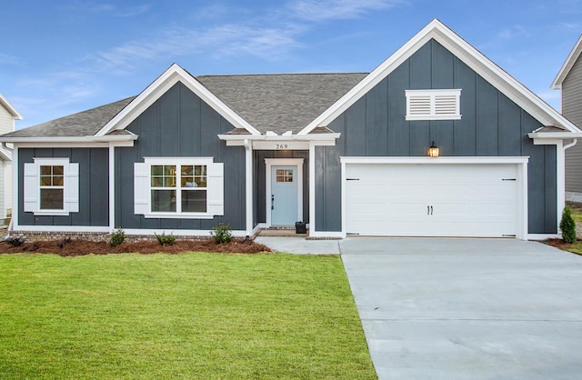 modern farmhouse with driveway, board and batten siding, a front yard, a garage, and a shingled roof