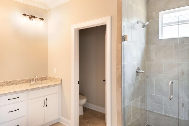 bathroom with a shower stall, vanity, crown molding, and toilet