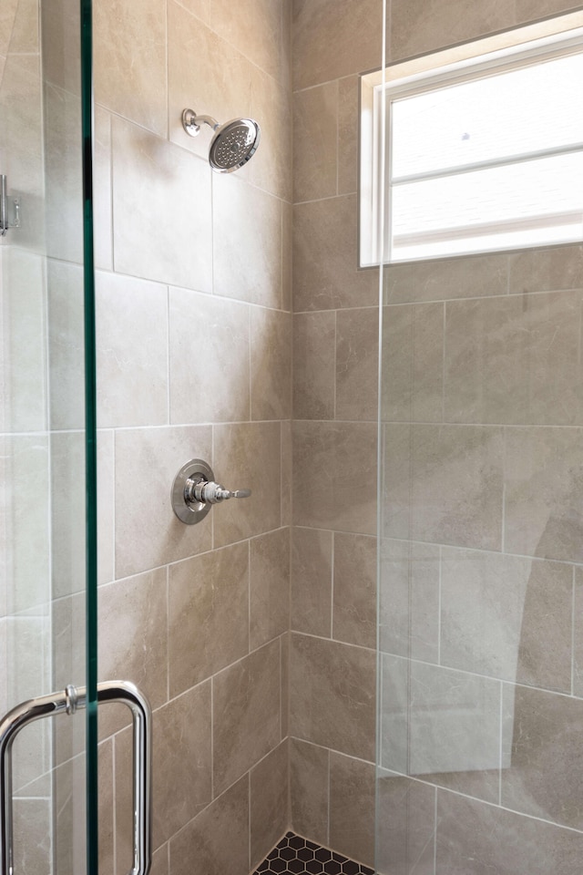 full bath with a shower stall