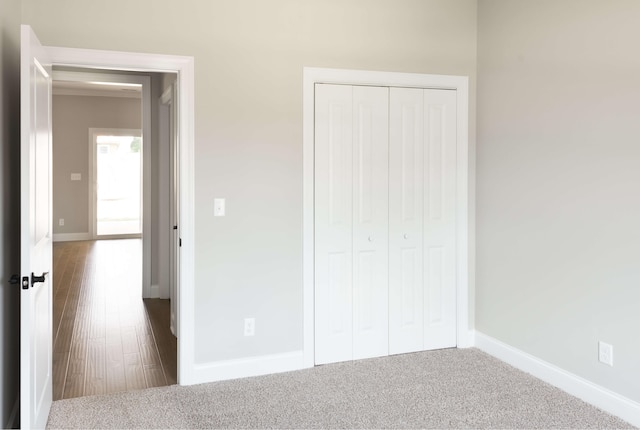 unfurnished bedroom featuring a closet and baseboards
