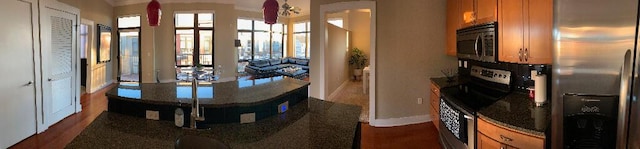 129 Walnut St Unit 322, Chattanooga, TN 37403 - dining area with dark wood-style flooring and baseboards